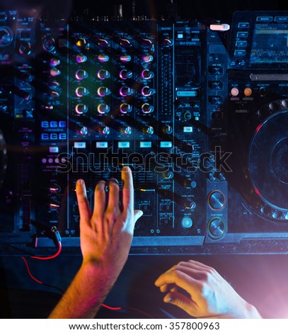 DJ turntable console mixer controlling with two hands