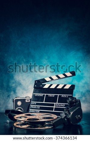 Retro film production accessories still life. Concept of film-making. Smoke effect on background