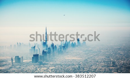 Dubai city in sunrise aerial view