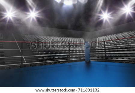 Empty boxing ring in arena, spot lights, smoke and dark night scene. Dramatic fighters background, extreme sport and exhibition.