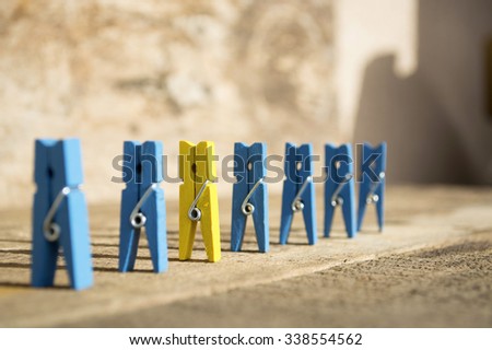 colorful wooden clothespin. selective focus image. be different concept