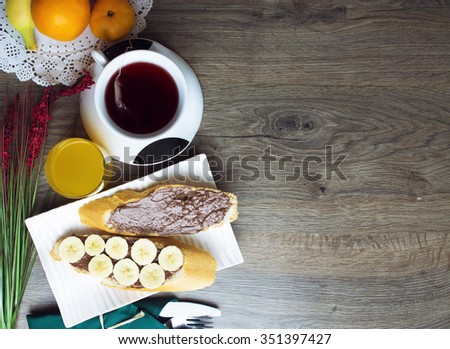 toast, chocolate spread with bread, tea, orange juice, fruit. healthy food, tasty concept. selective focus, toned image
