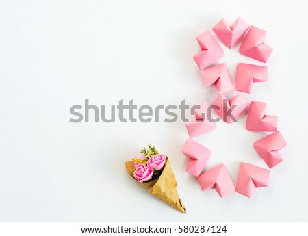 Happy International Women’s Day celebrate on March 8, congratulatory CARD.  rose-color paper hearts shape figure eight 8 on white background