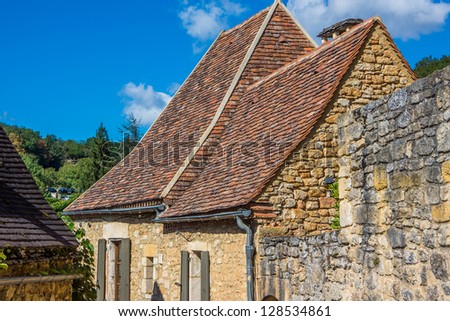 Roof tops of the houses inside the walls of chateau of Castlenaud river in France.