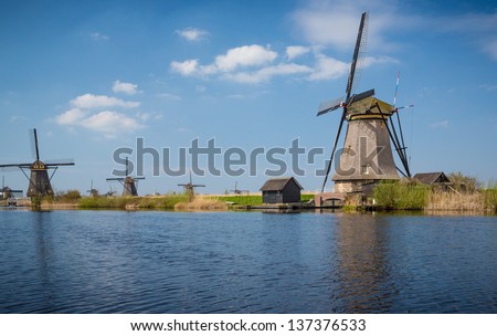 Nine windmills in Holland Holland field by water