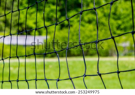 Volley ball net with green background of summer