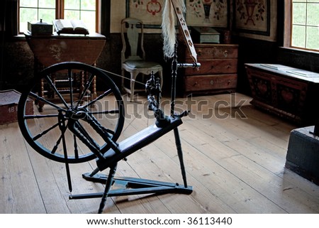Old fashioned spinning wheel used in making yarn in Skansen, Stockholm, Sweden