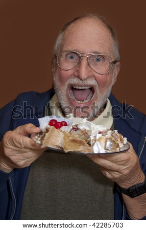 Senior man opens mouth wide in anticipation of desserts-Edit