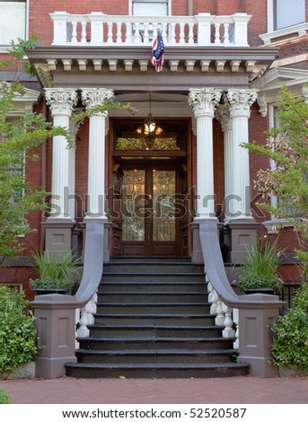 Grand entrance to colonial style house.