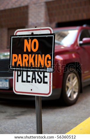 Car parked in no parking zone, breaking the law
