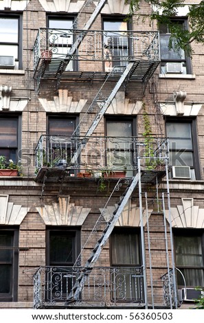 New York City Village apartment building with plants on the fire escape