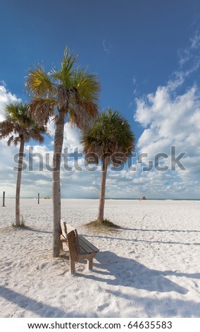 Cabbage palms frame entrance to Siesta Cay beach in FL