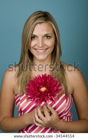 Woman holding pink flower