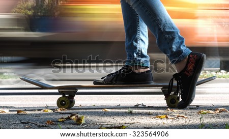 Feet, skate. Cars speed past. The speed