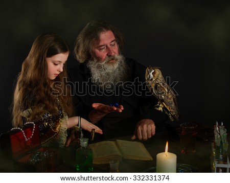 The Wizard and the Princess. The old man a magician, an alchemist and a student. Owl. Ancient Tome of the book. Many chemical vessels, retorts, flasks. Casket with dragotsnnostyami. Jewellery.