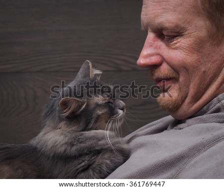 Man and cat sleeping together. Man and cat happy. Rest together