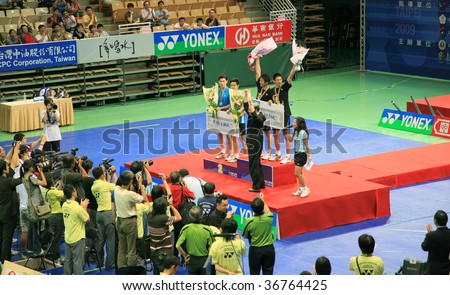 TAIPEI - AUG 30: Taiwan badminton players won the 2009 Yonex Chinese Taipei Badminton Open women\'s singles and men\'s doubles champion August 30, 2009 in Taipei, Taiwan.