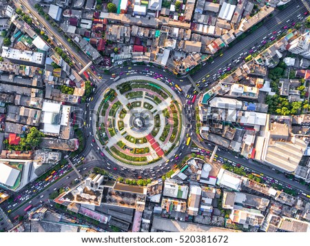Aerial view Road roundabout with car lots Wongwian Yai in Bangkok,Thailand.street large beautiful downtown at night.cityscape.