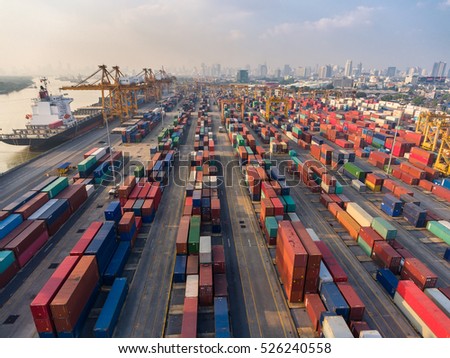 container,container ship in import export and business logistic.By crane , Trade Port , Shipping.Tugboat assisting cargo to harbor.Aerial view.Water transport.International.Shell Marine.transaction.