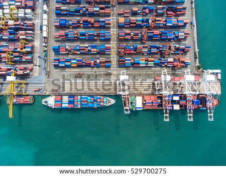container,container ship in import export and business logistic.By crane , Trade Port , Shipping.Tugboat assisting cargo to harbor.Aerial view.Water transport.International.Shell Marine.transaction.