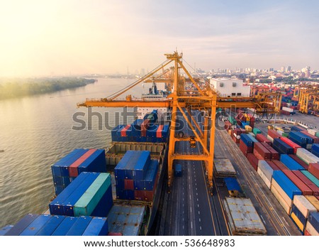 container,container ship in import export and business logistic.By crane ,Trade Port , Shipping.cargo to harbor.Aerial view.Water transport.International.Shell Marine.transportation.