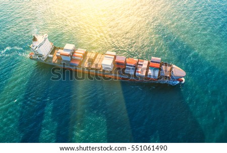 container,container ship in import export and business logistic.By crane ,Trade Port , Shipping.cargo to harbor.Aerial view.Water transport.International.Shell Marine.Top view.