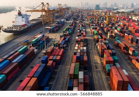 container,container ship in import export and business logistic.By crane ,Trade Port , Shipping.cargo to harbor.Aerial view.Top view.
