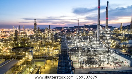 Oil refinery.With a background of the city.The factory is located in the middle of nature and no emissions.The area around the air pure.business logistic.Aerial view.Top view.Light of the evening sky.