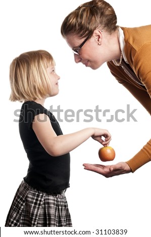 Schoolchild gives teacher apple on white background