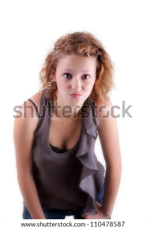 Cute teenage girl poses on white background and shows attitude; series; more of this same model in portfolio