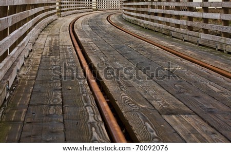 Railroad track bridge with leading lines and selective focus at the curve