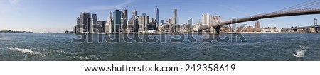 The New York City Downtown panorama at the afternoon w Brooklyn Bridge
