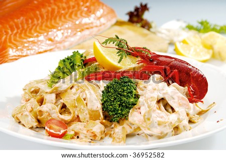 Craw fish on the top of pasta and vegetable