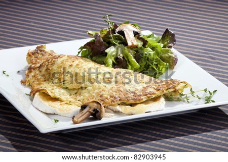 Potato pancake filled by grilled camembert and mushrooms