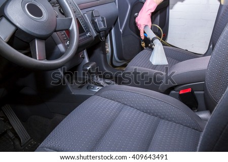Car interior textile seats chemical cleaning with professionally extraction method.  Early spring cleaning or regular clean up.