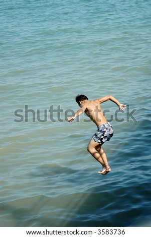 Man diving into water for a swim