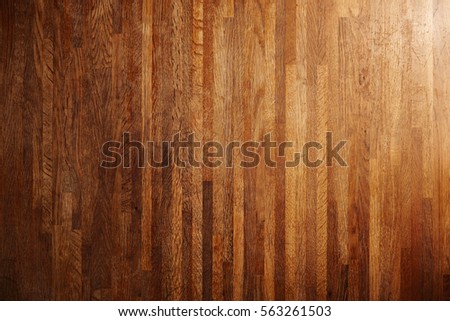 Rich texture of wooden table or floor made of many thin long racks placed vertically, top view, natural rustic background