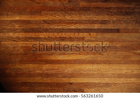 Rich texture of wooden table or floor made of many thin long racks placed horizontally, top view, natural rustic background