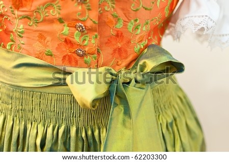 dirndl dress in orange and green color