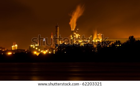 industrial buildings by night, smoke