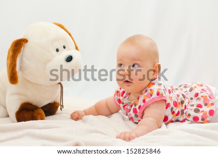 baby portrait with her dog toy