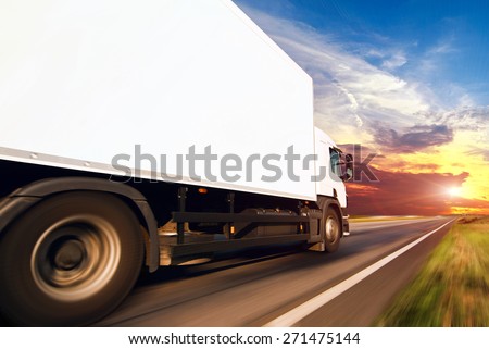 White truck on the asphalt rural road
