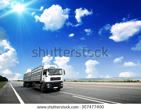 Modern Semi Truck in Motion. American Highway Trucking. Summer on the Highway