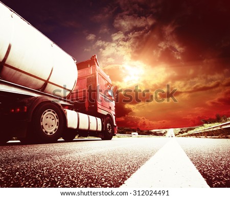 Semi Truck In Motion. Speeding Truck on the Highway. Trucking Business Concept