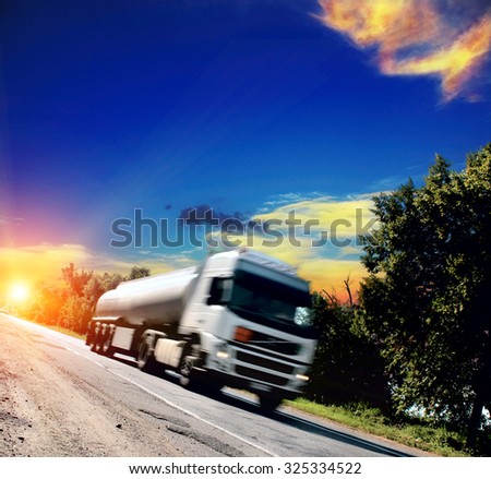 white big truck on the asphalt road