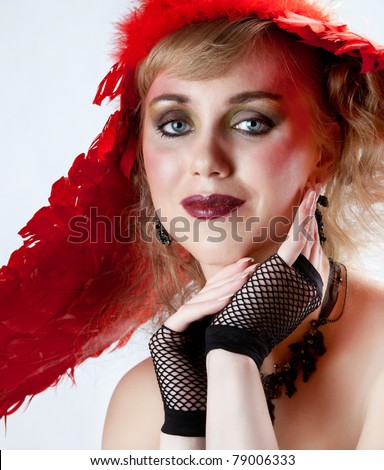 Bright makeup and a red hat