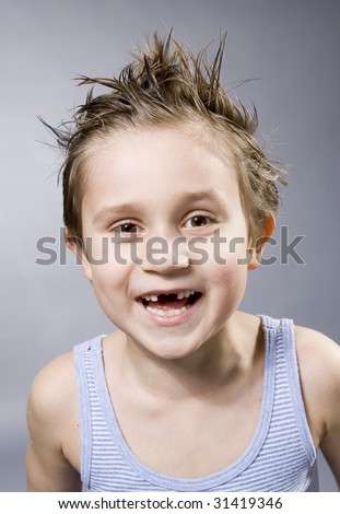 smart boy with a teeth gap smiling