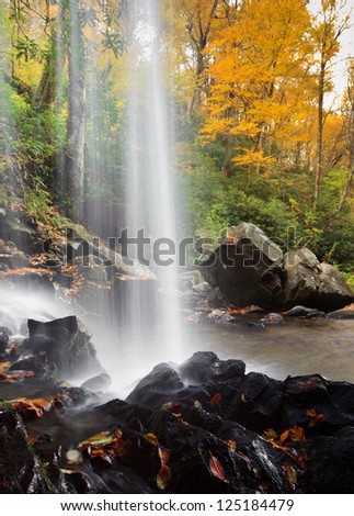 Grotto Falls, shot behind the falls in autumn colors, the great smokey mountains national park