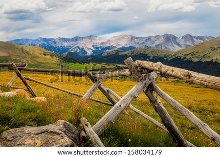 Rocky Mountains National Park, fence in the foreground with distant mountains