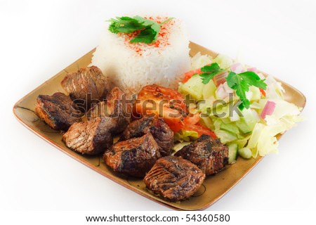Meat dish originating in the middle east, sevived with rice , salad and bread.